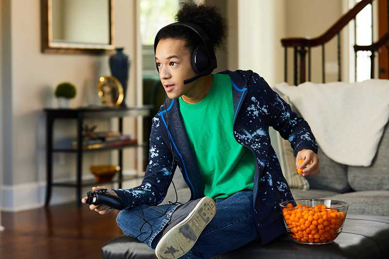 teenager playing video game